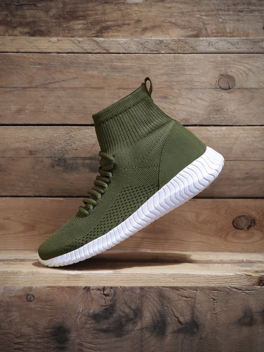 

Roadster Women Olive Green Solid Mid-Top Sneakers