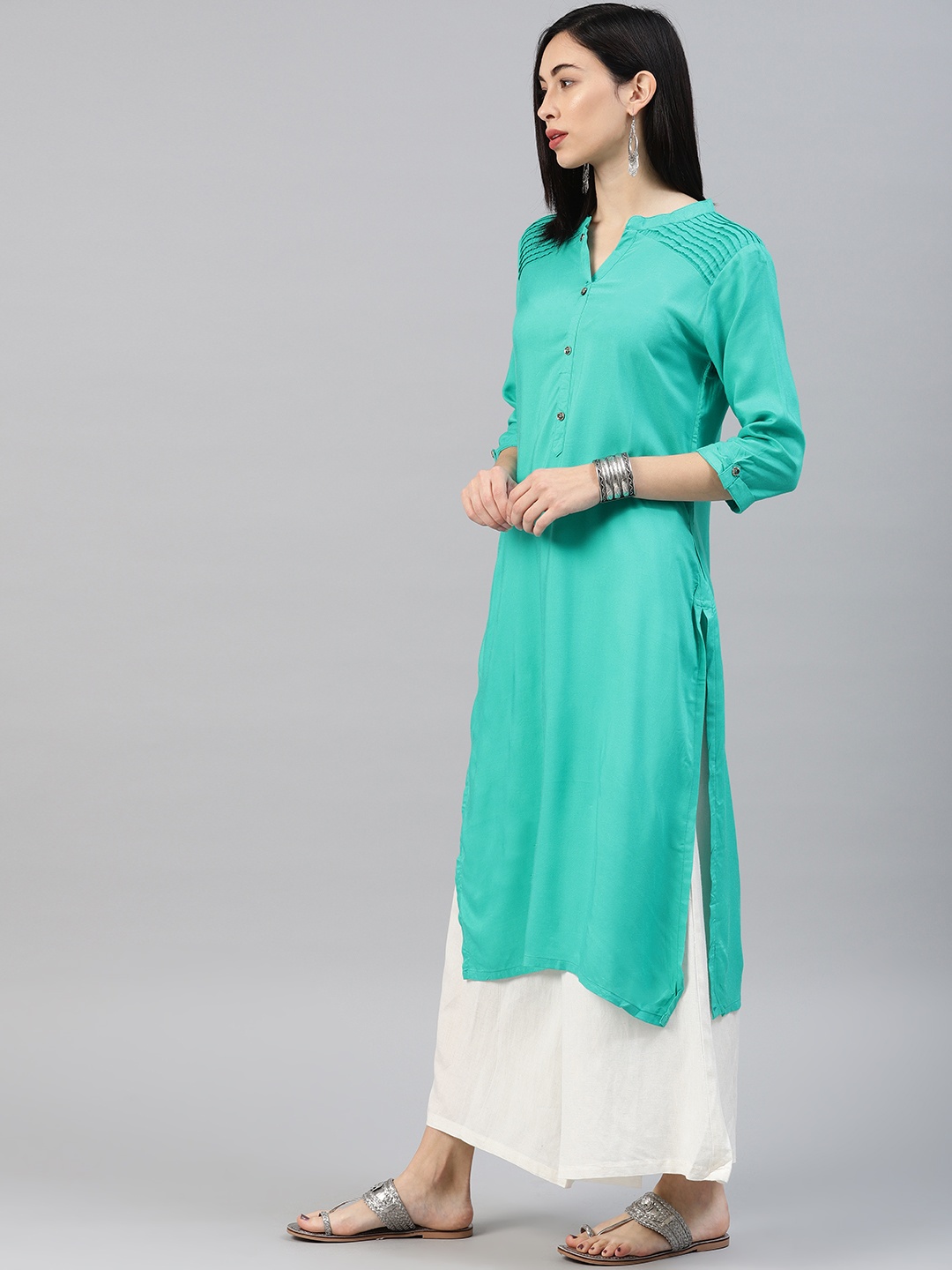 

Alena Women Sea Green Solid Straight Kurta