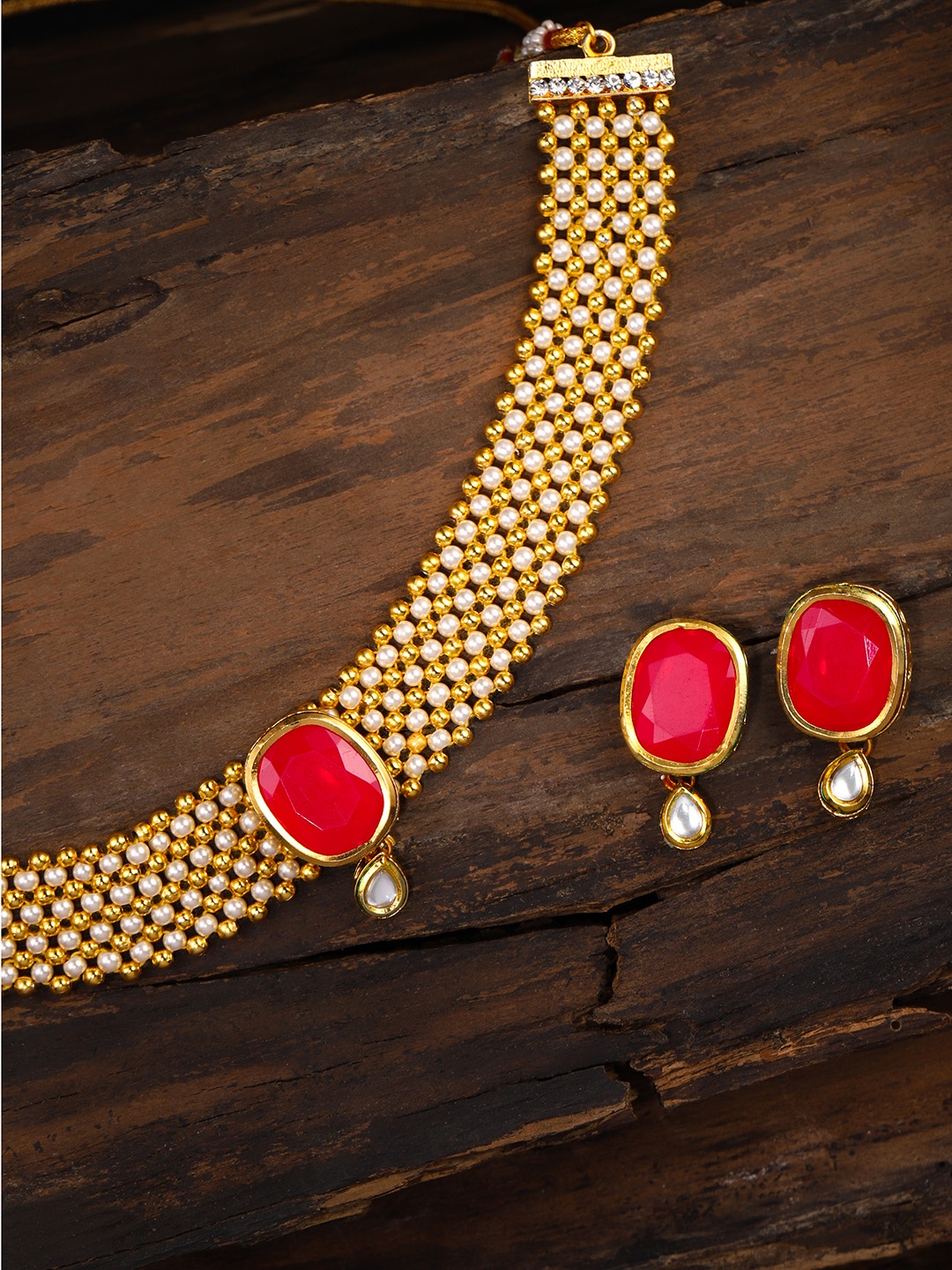 

Zaveri Pearls Gold Toned & White Kundan Jewellery Set