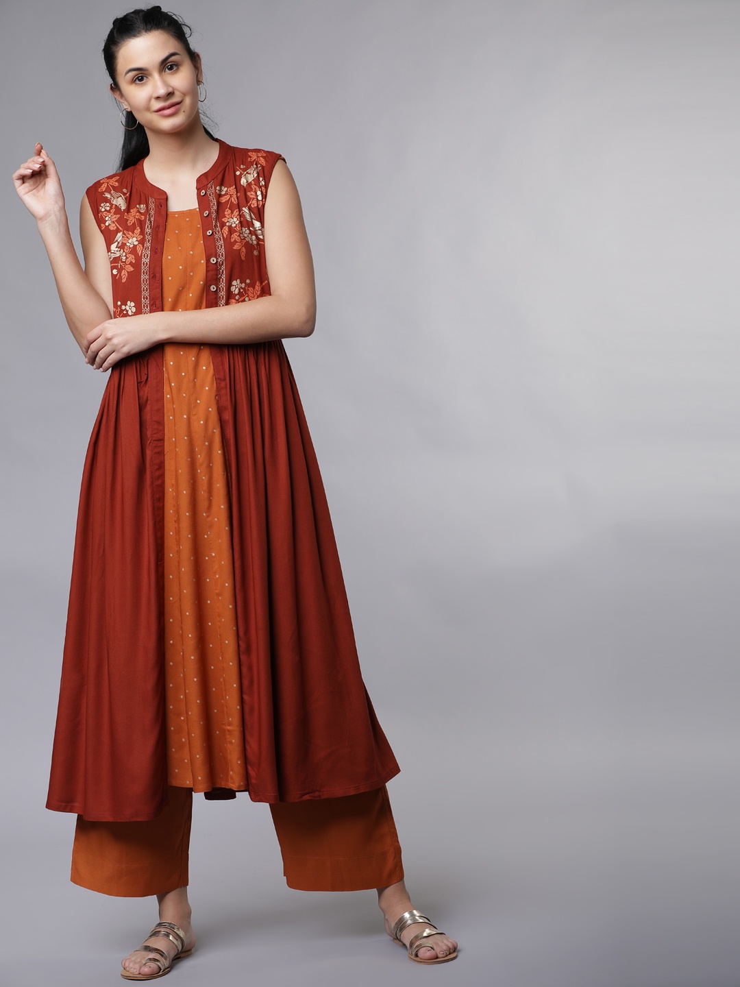 

Vishudh Women Rust & Orange Solid Kurta with Palazzos