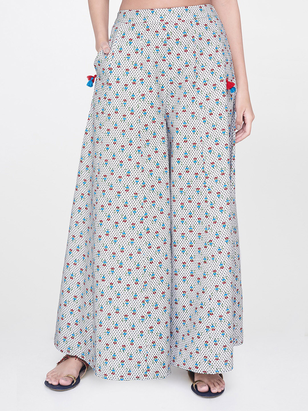 

Global Desi Women Off-White Printed Flared Palazzos