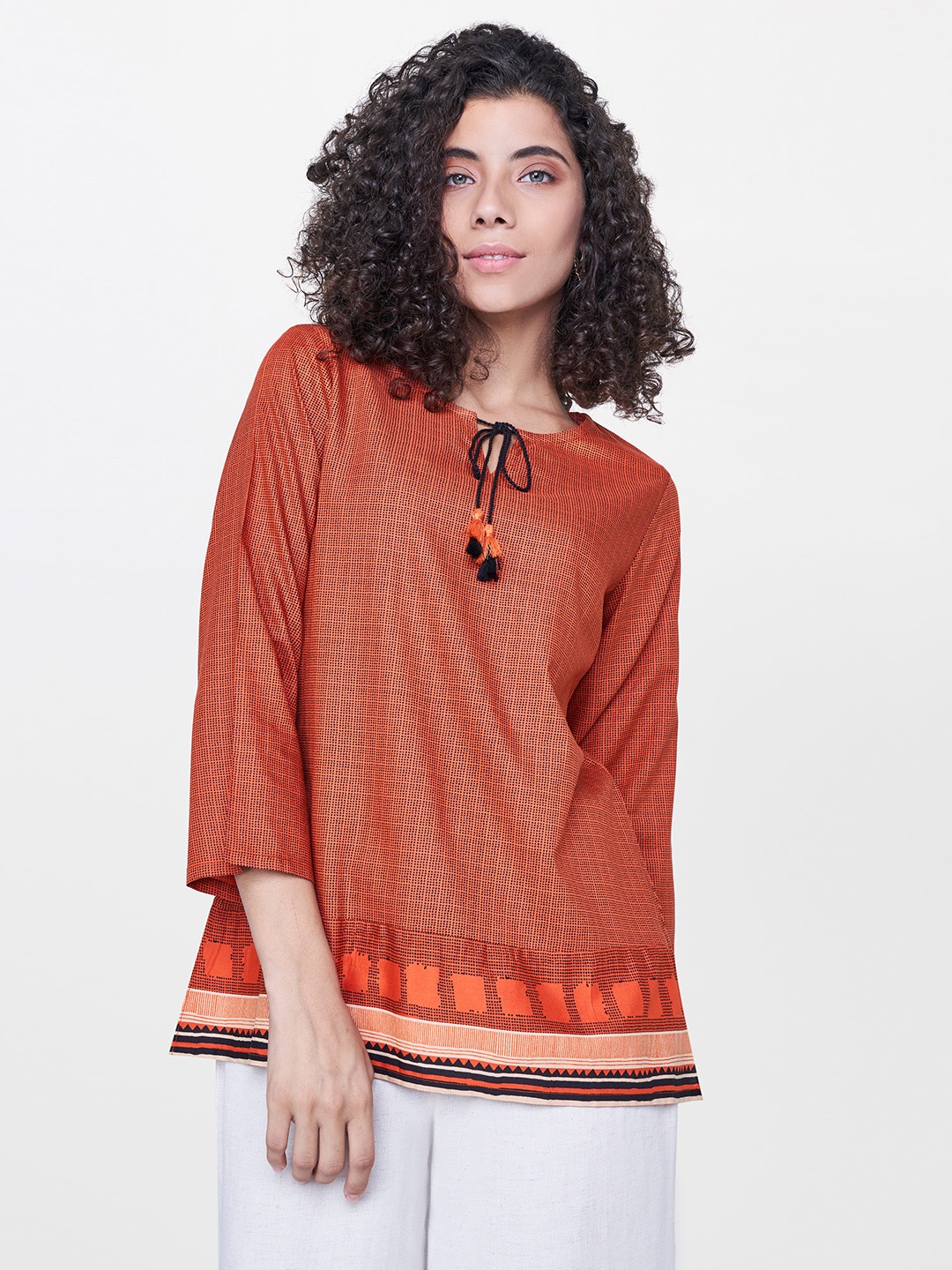

Global Desi Women Rust Orange Printed Top