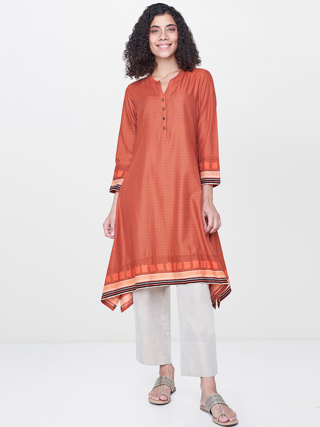 

Global Desi Women Orange Printed A-Line Asymmetric Kurta