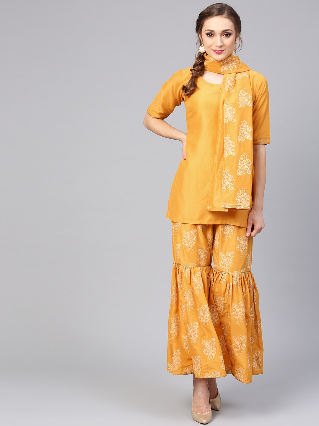 

Libas Women Mustard Yellow & White Solid Kurti with Printed Sharara & Dupatta