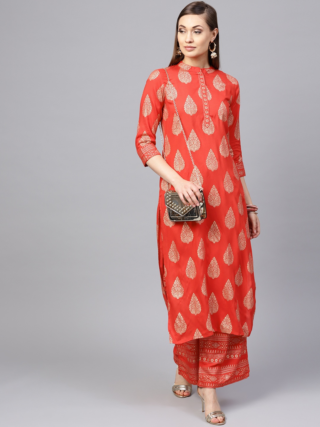 

Yuris Women Orange & Golden Printed Kurta with Palazzos