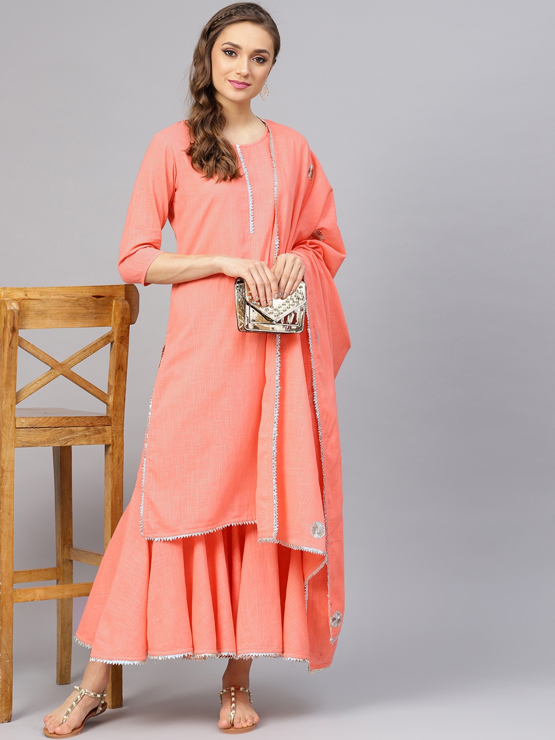 

Idalia Women Peach-Coloured Solid Kurta with Sharara & Dupatta