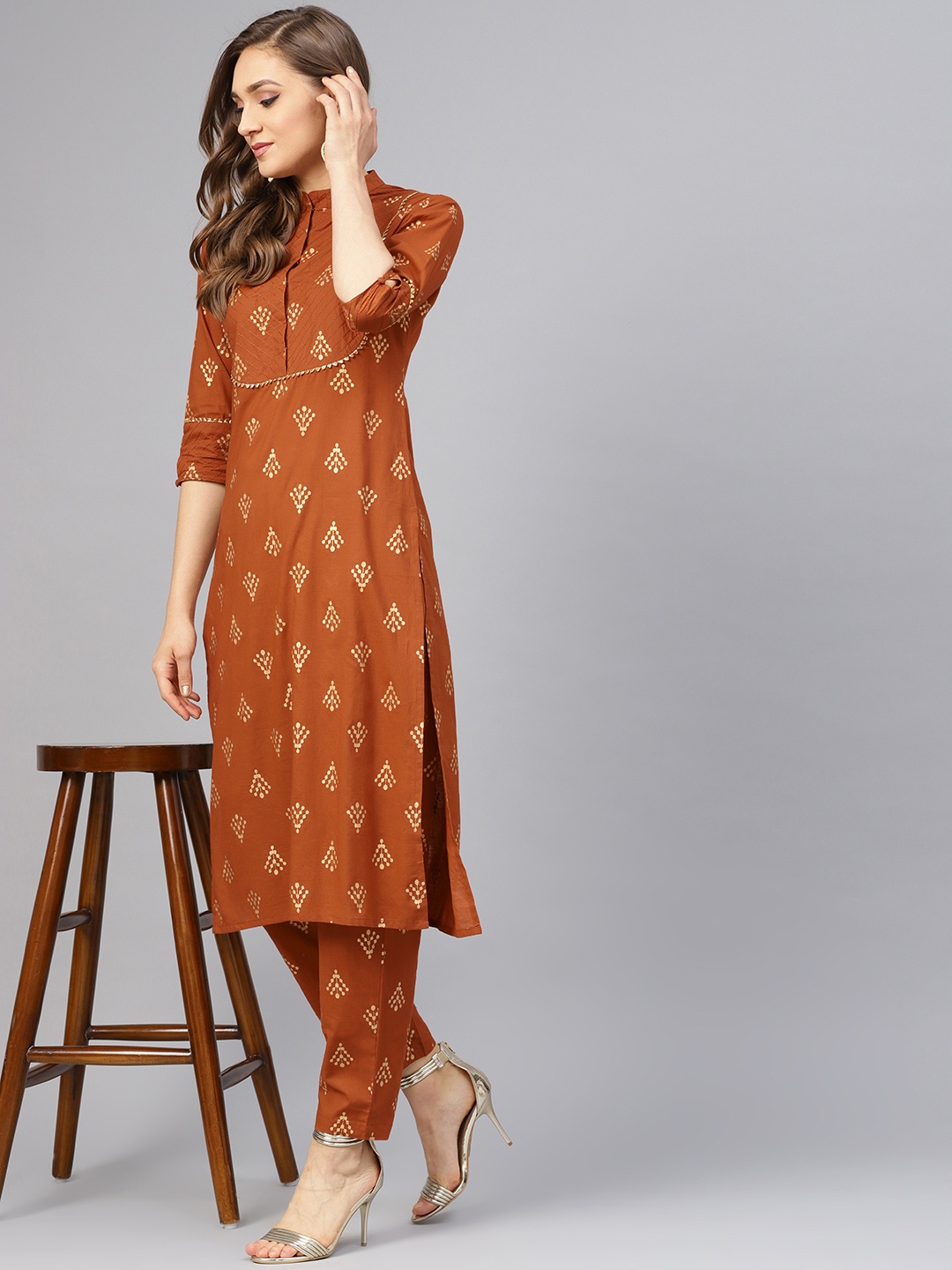 

Idalia Women Brown & Golden Printed Kurta with Trousers