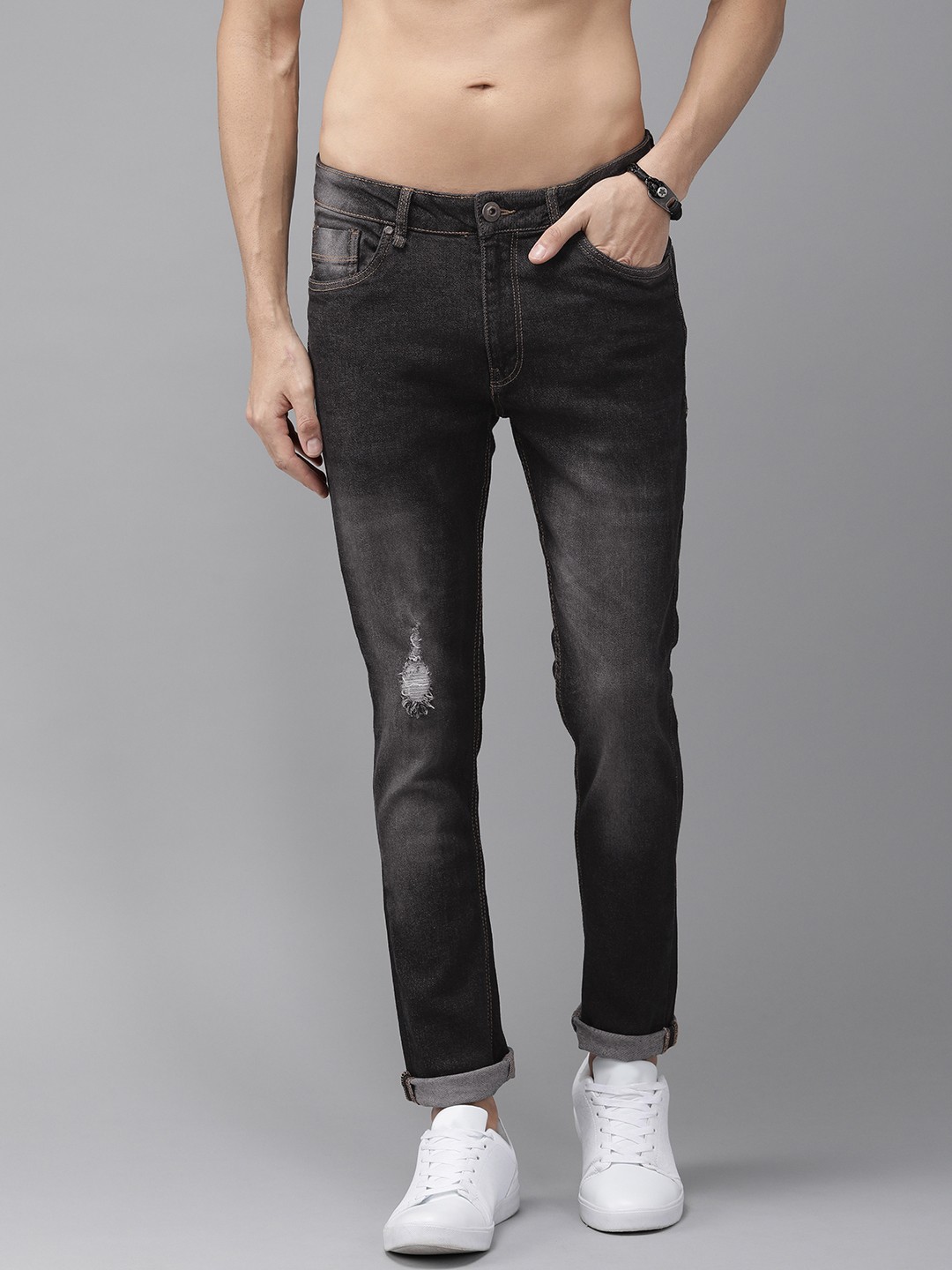 

The Roadster Lifestyle Co Men Charcoal Grey Skinny Fit Mid-Rise Low Distress Stretchable Jeans