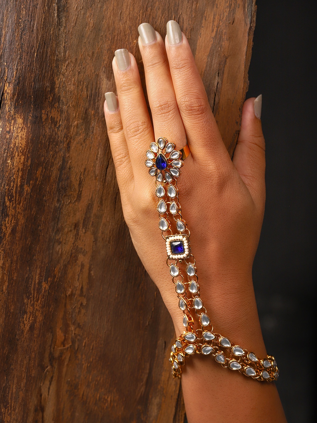

Zaveri Pearls Gold-Toned & Navy Kundan Blue Ring Bracelet