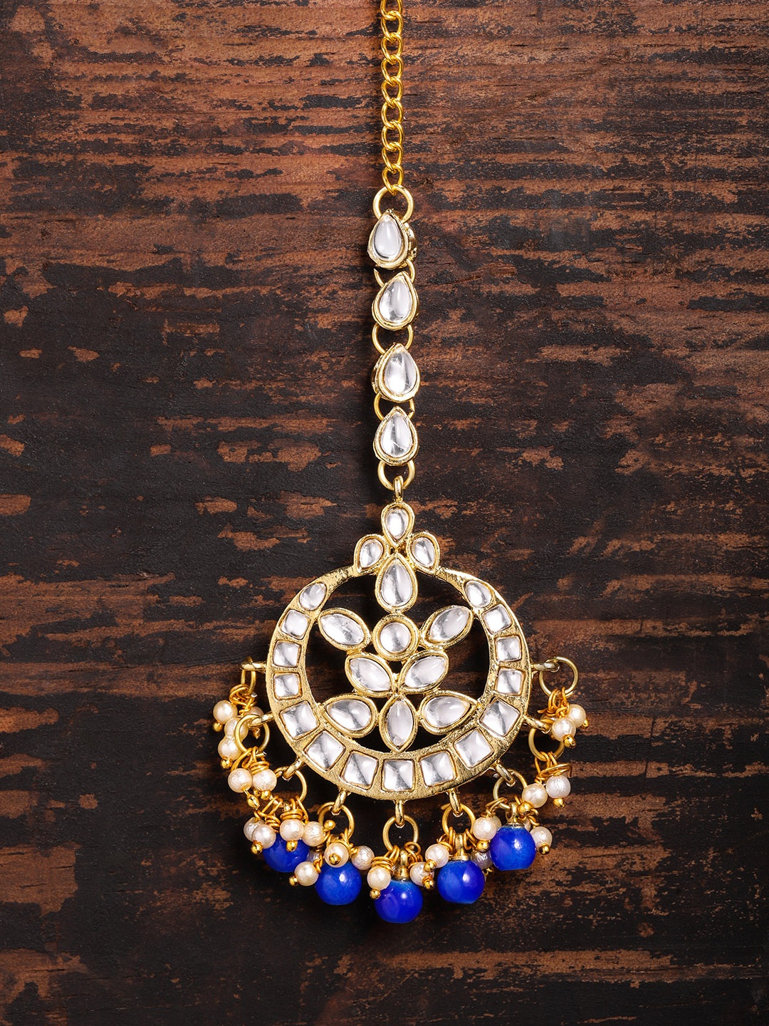 

Zaveri Pearls Gold Toned & Blue Kundan Maangtikka