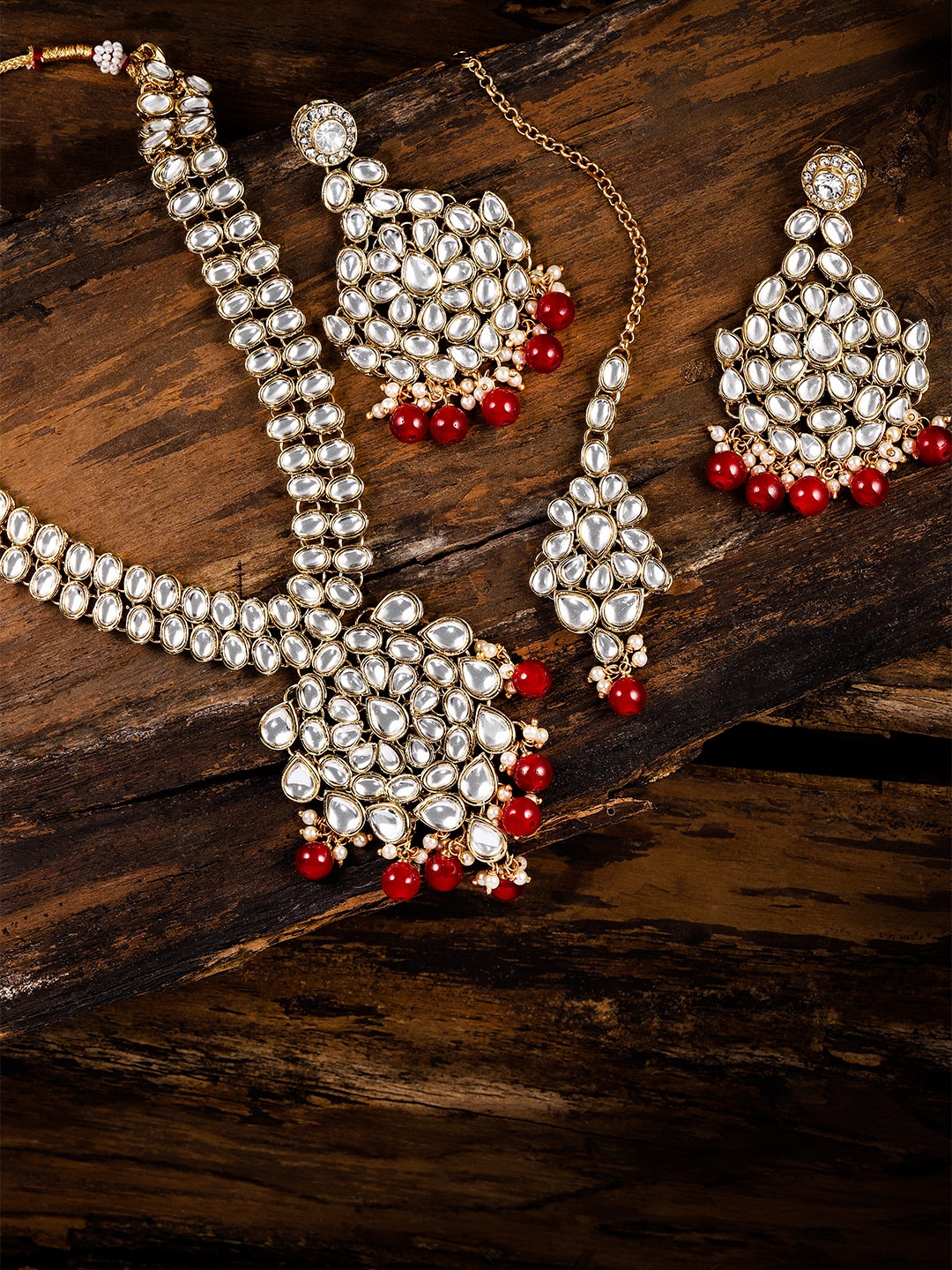 

Zaveri Pearls Gold Toned & Red Kundan Jewellery Set