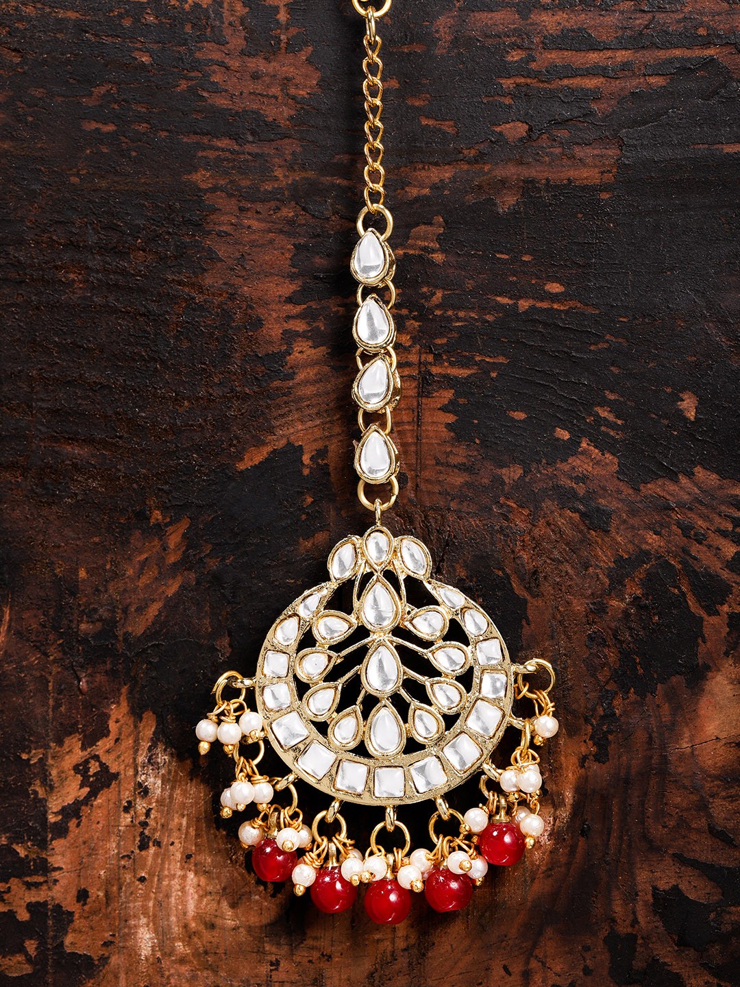 

Zaveri Pearls Gold Toned & Red Kundan Maangtikka