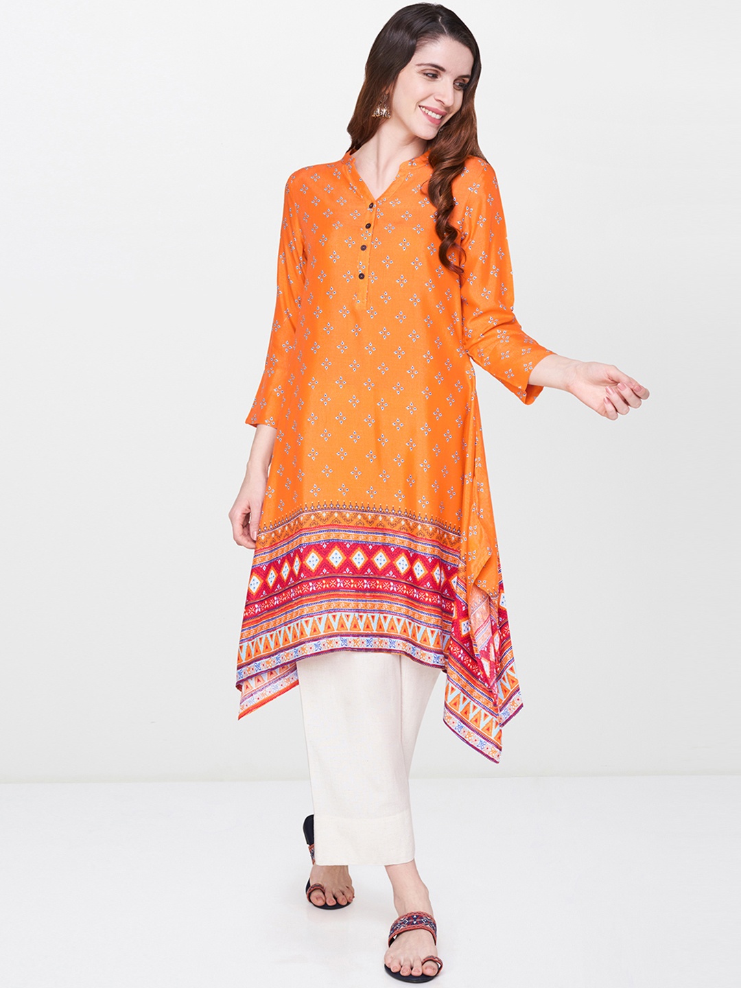 

Global Desi Women Orange Printed Asymmetric A-Line Kurta