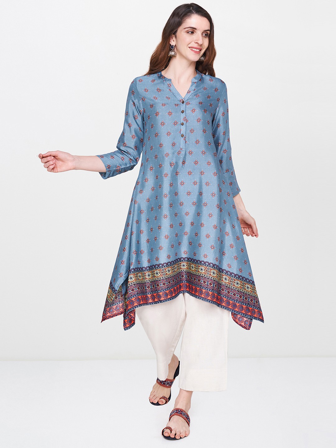 

Global Desi Women Blue Printed Asymmetrical Hem A-Line Kurta