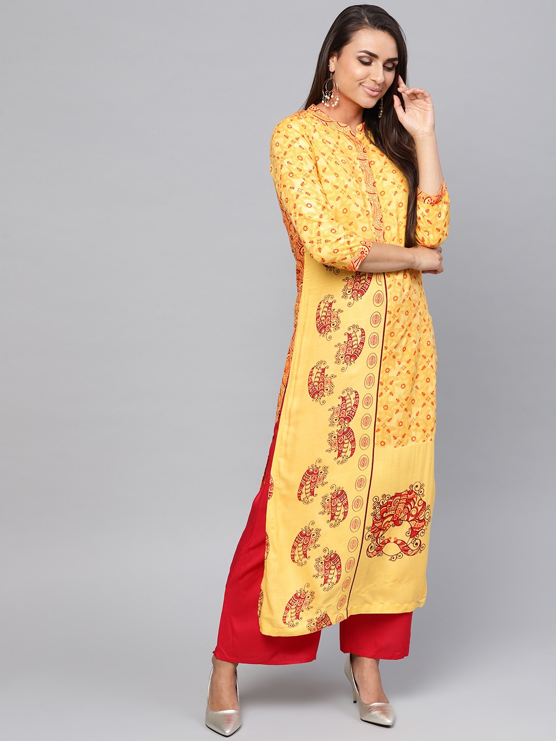 

Pannkh Women Yellow Printed Straight Kurta