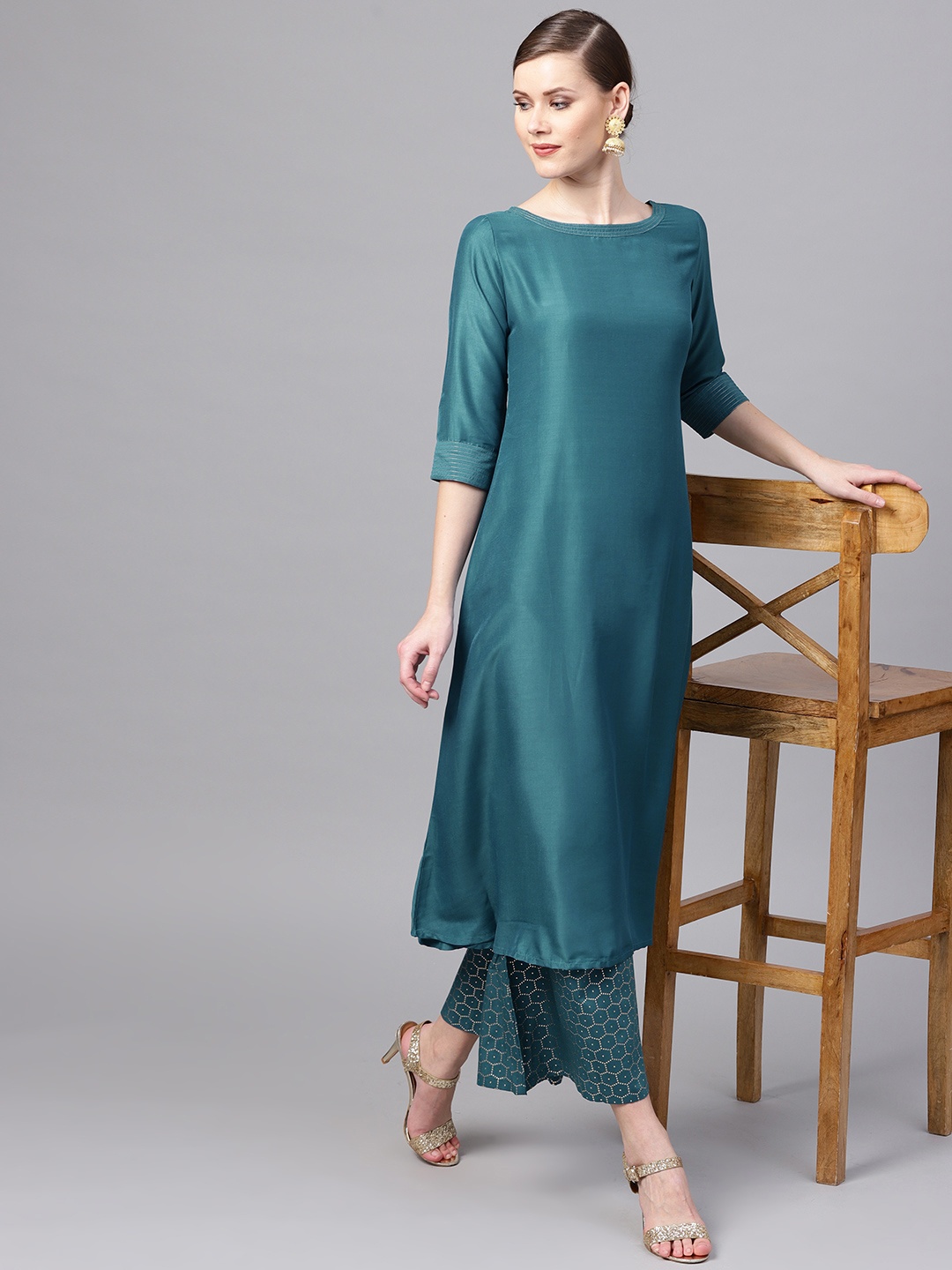

Libas Women Teal Blue Solid Kurta with Palazzos