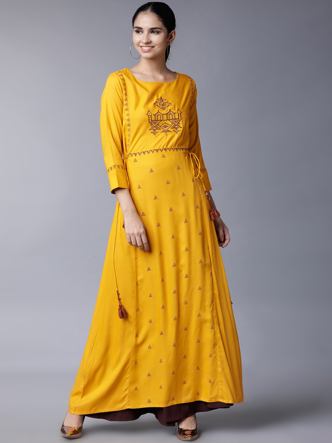 

Vishudh Women Yellow Solid A-Line Kurta