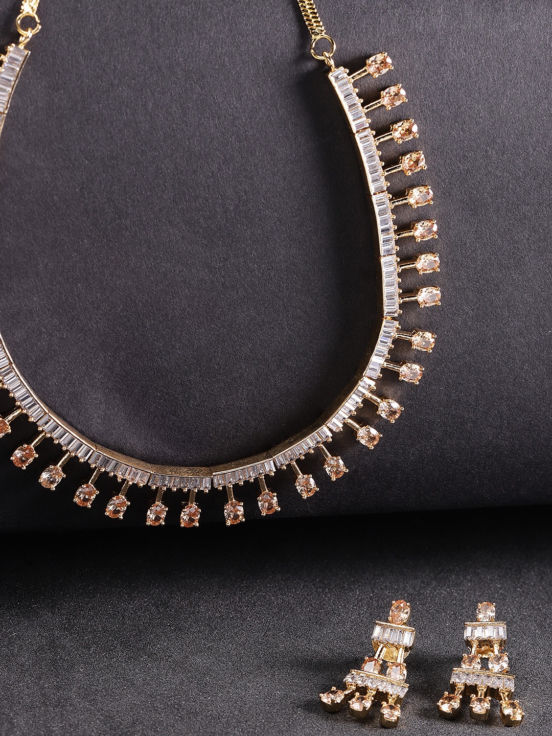 

Priyaasi Peach-Coloured Gold-Plated American Diamond Studded Jewellery Set