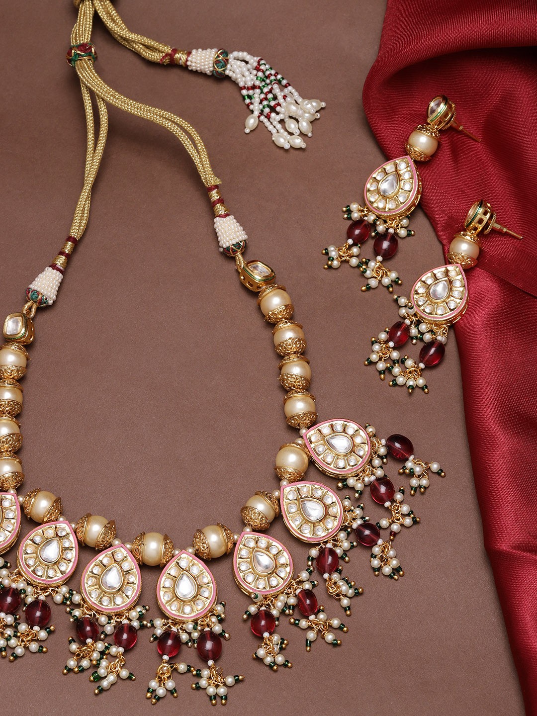 

Priyaasi Cream-Coloured & Maroon Gold-Plated Stone-Studded Handcrafted Jewellery Set