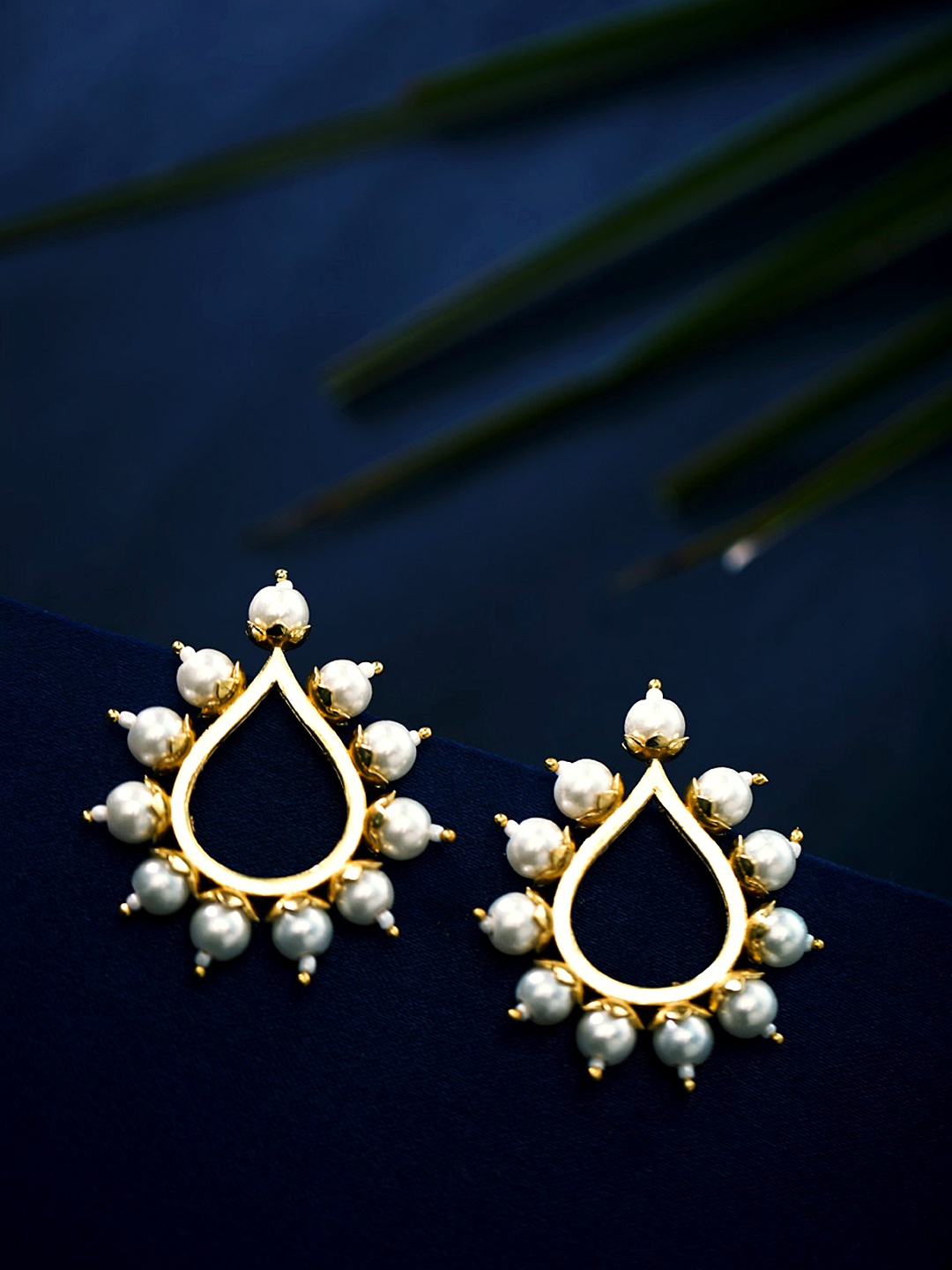 

Voylla Gold-Toned & White Teardrop Shaped Studs