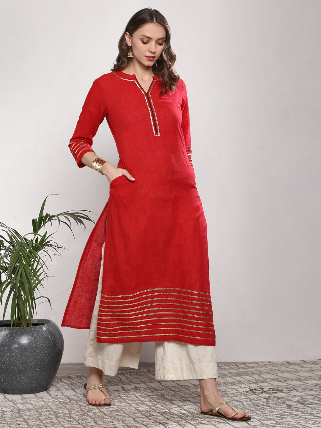 

Sangria Women Red Straight Fit Kurta with Gota Patti Detail