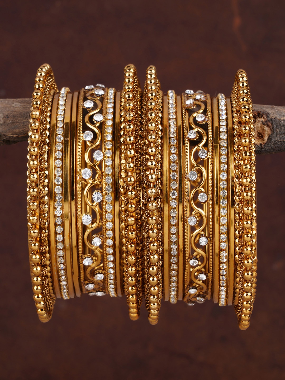 

Shining Diva Set of 18 Gold Plated Stone-Studded Bangles