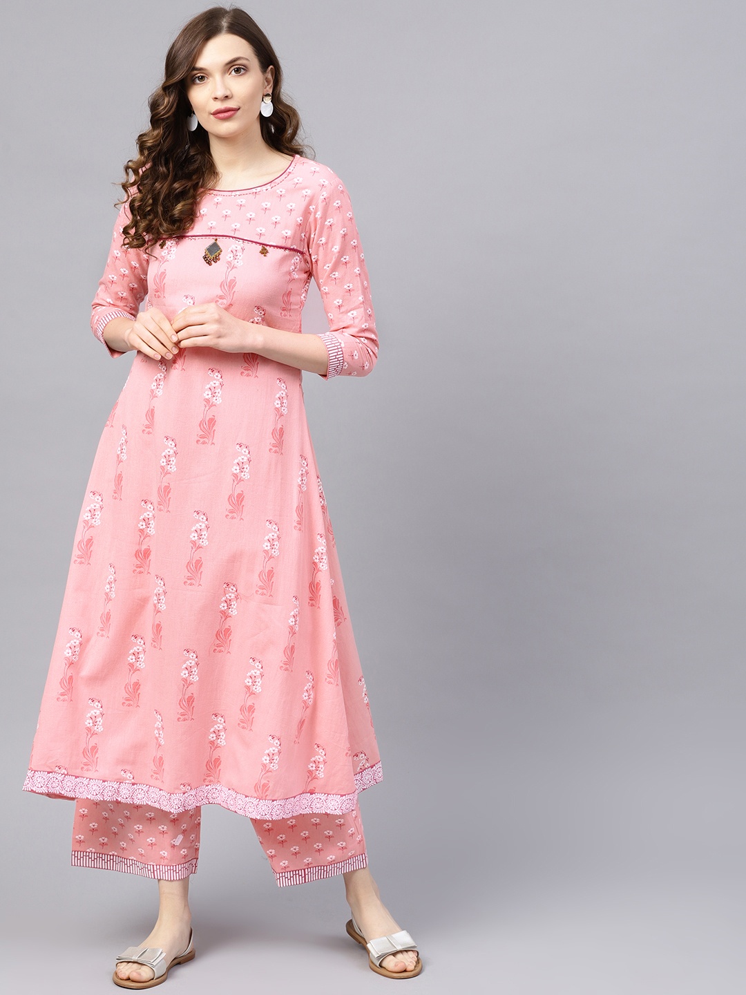 

Ishin Women Pink & White Printed Kurta with Palazzos