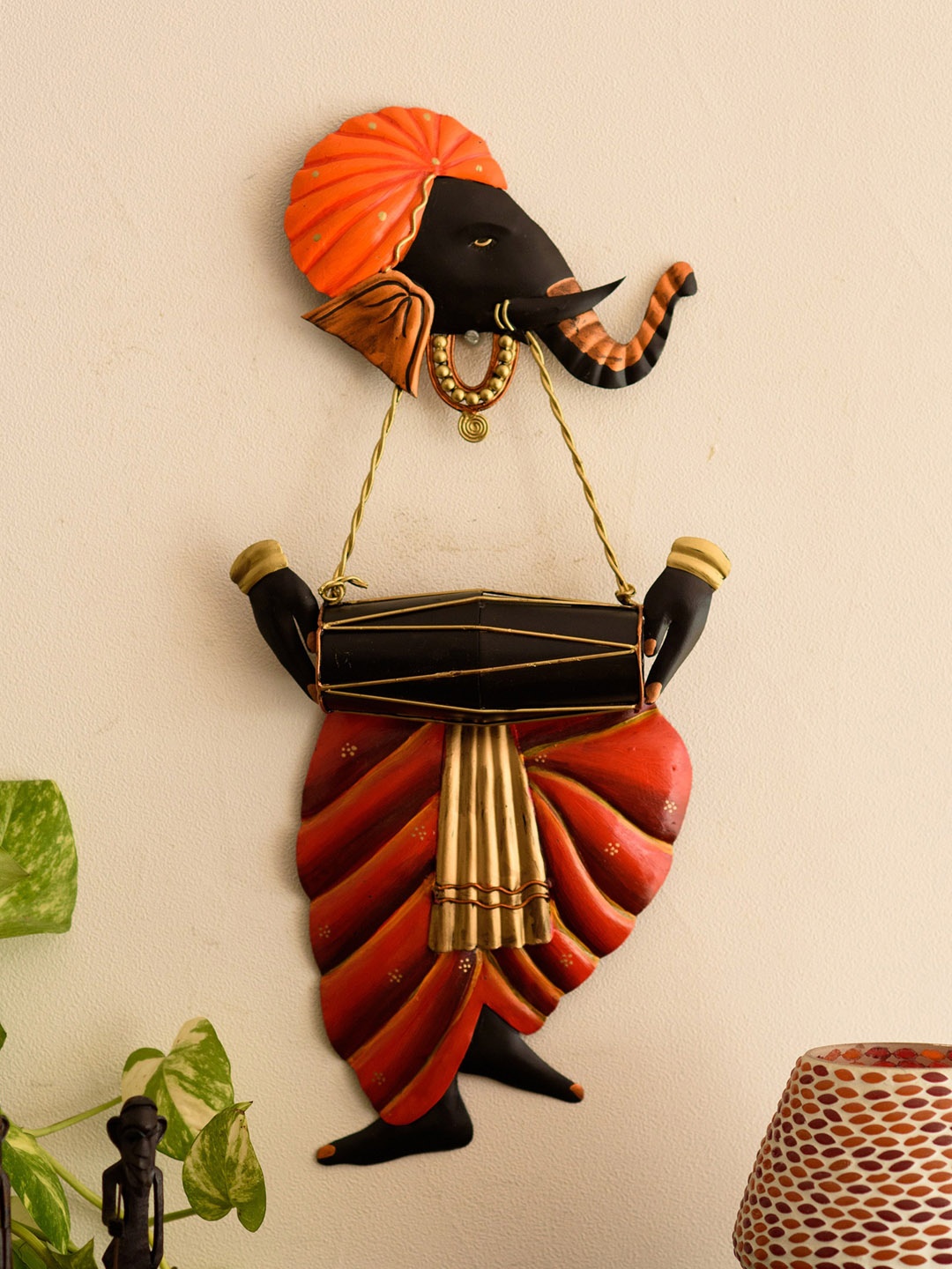 

eCraftIndia Orange & Black Ganesha Playing Dholak Wall Hanging