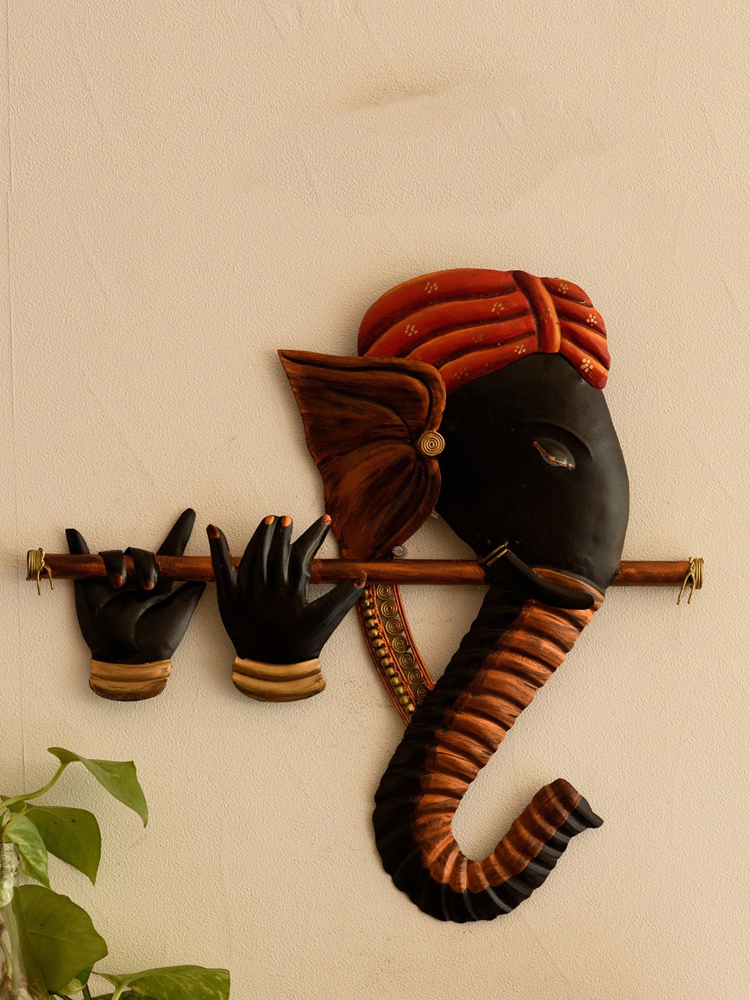 

eCraftIndia Orange & Black Iron Bansuri Ganesha Wall Hanging