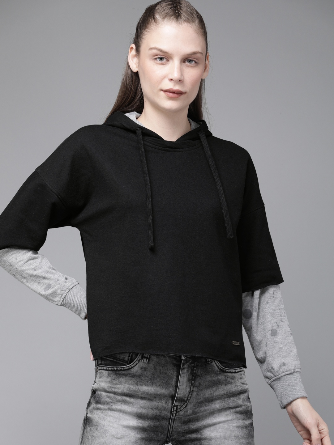 

The Roadster Lifestyle Co Women Black Solid Hooded Sweatshirt