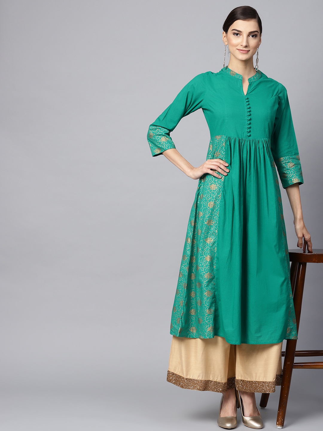 

Meeranshi Women Green & Golden Printed A-Line Kurta