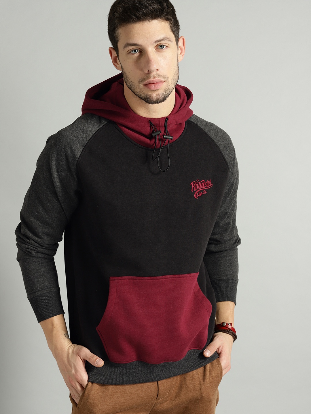 

The Roadster Lifestyle Co Men Black & Maroon Colourblocked Hooded Sweatshirt