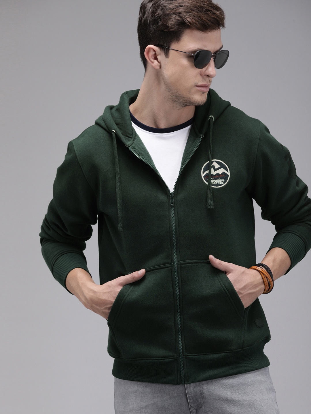 

The Roadster Lifestyle Co Men Green Solid Hooded Sweatshirt