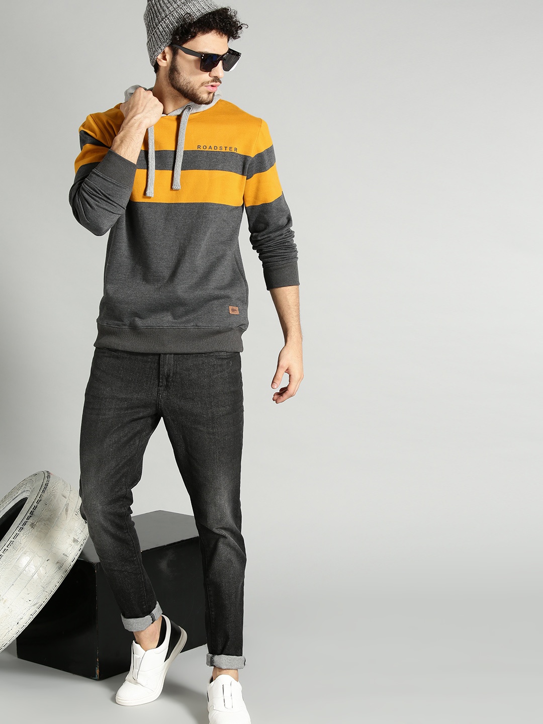 

The Roadster Lifestyle Co Men Charcoal Grey & Mustard Yellow Colourblocked Hooded Sweatshirt