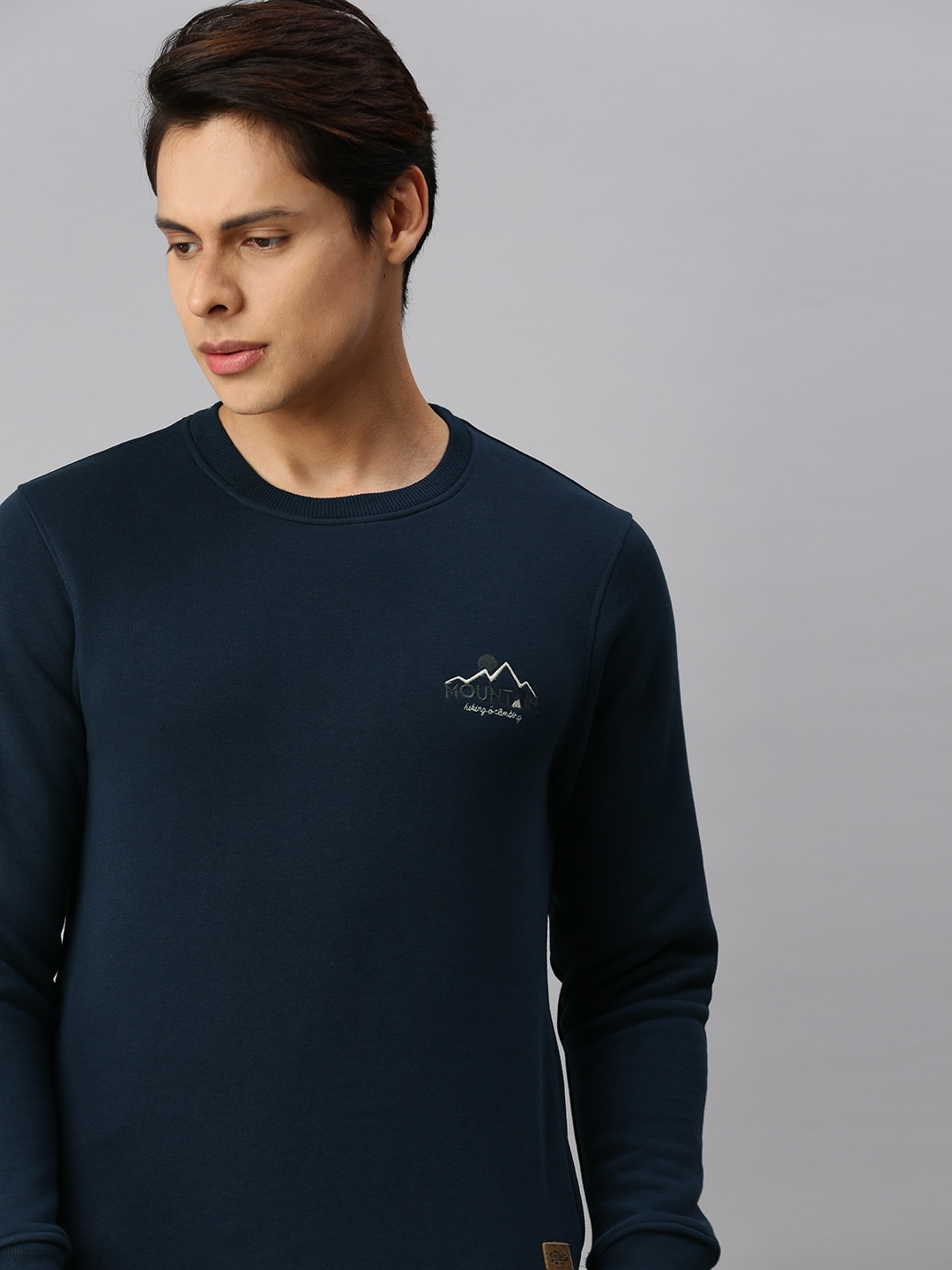

The Roadster Lifestyle Co Men Navy Blue Solid Sweatshirt