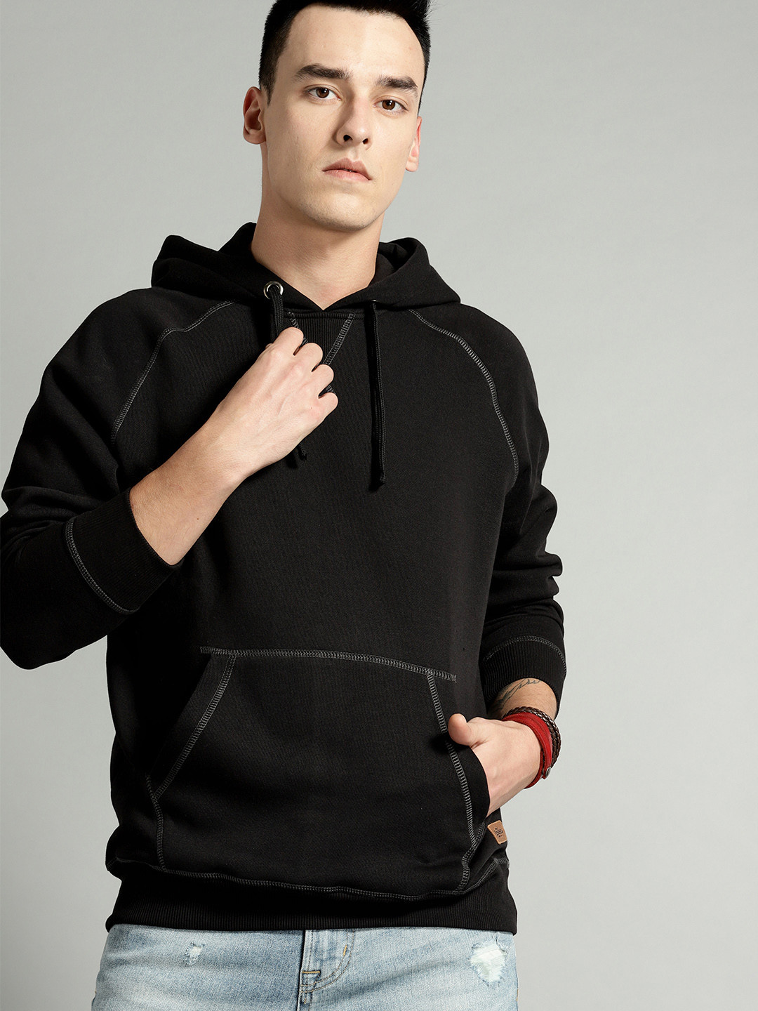 

The Roadster Lifestyle Co Men Black Solid Hooded Sweatshirt