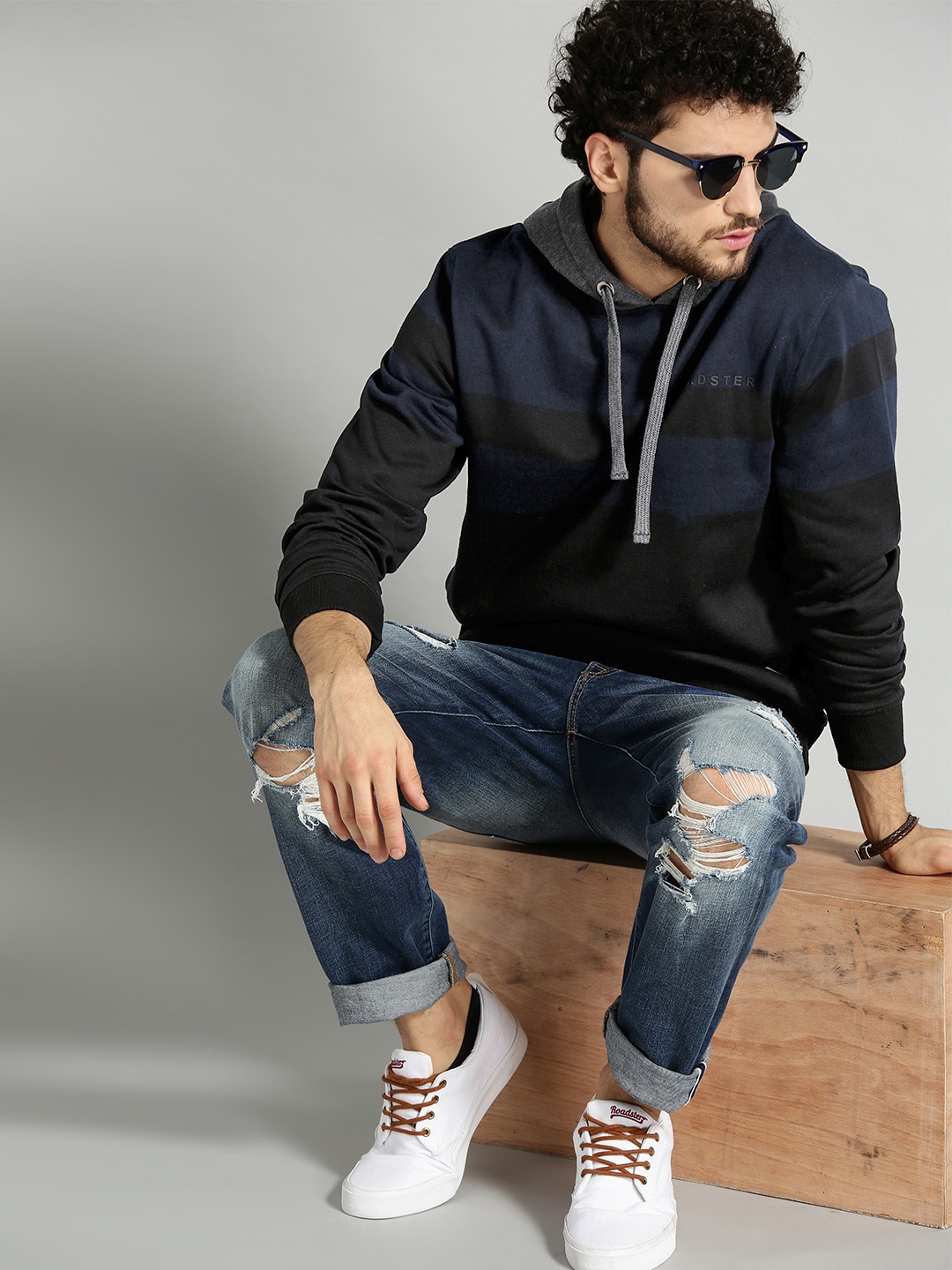 

The Roadster Lifestyle Co Men Charcoal Grey & Navy Blue Colourblocked Hooded Sweatshirt