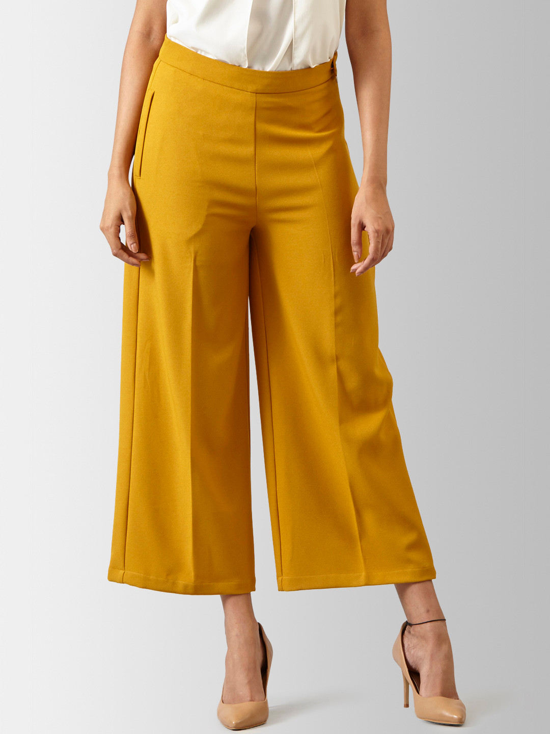 

FableStreet Women Mustard Flared Solid Parallel Trousers