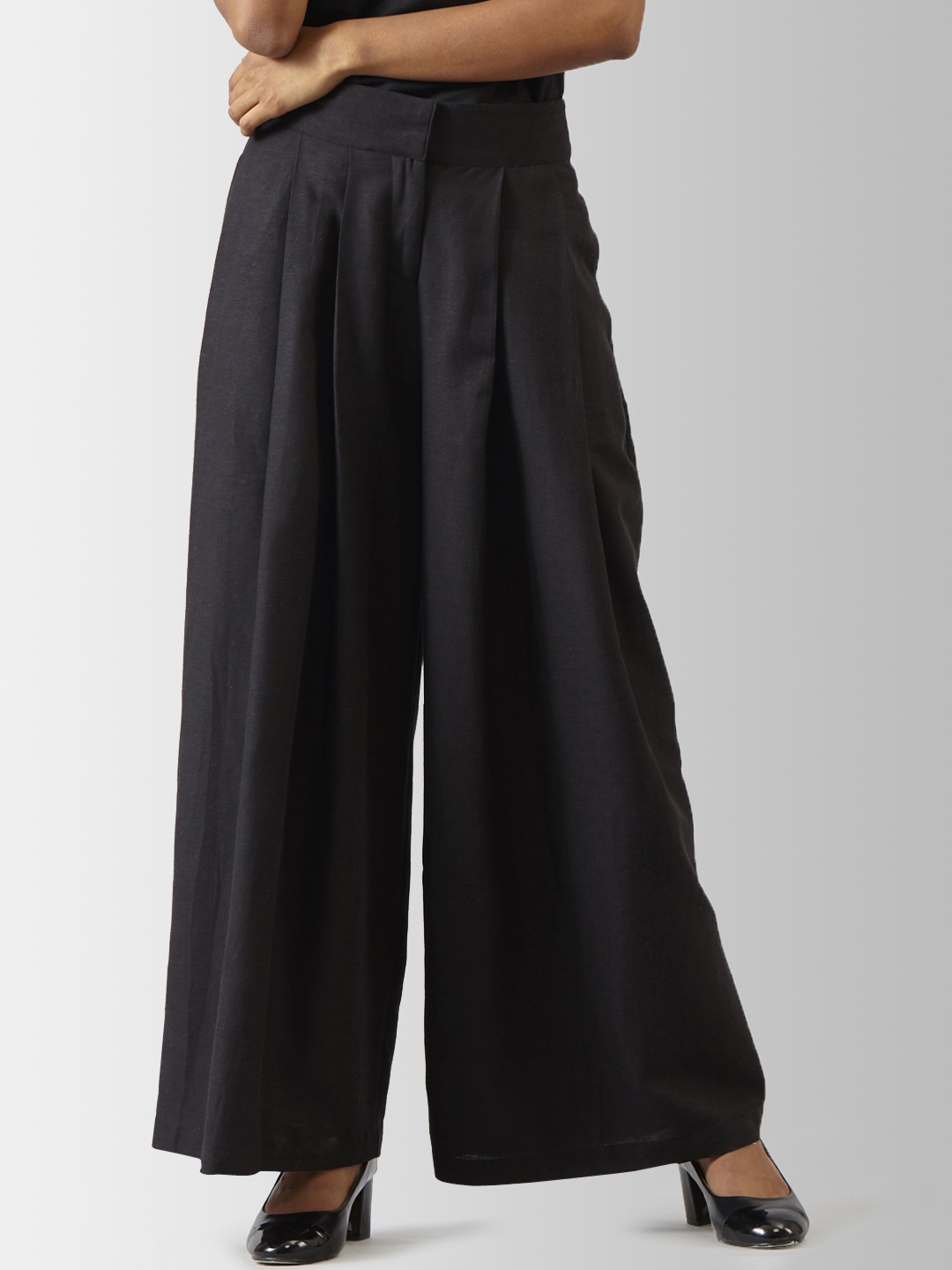 

FableStreet Women Black Flared Solid Parallel Trousers