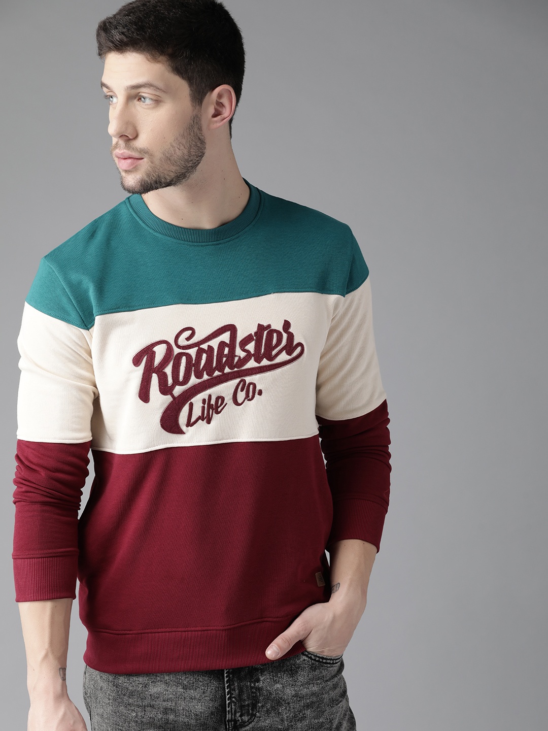 

The Roadster Lifestyle Co Men Maroon & Off-White Colourblocked Sweatshirt with Applique Detail