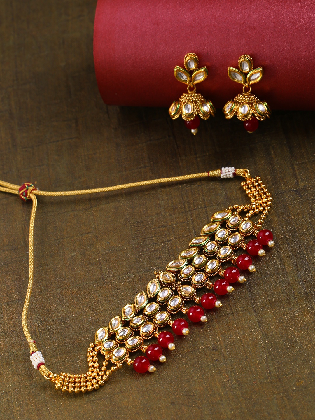 

Priyaasi Maroon Gold-Plated Handcrafted Kundan Stone-Studded Beaded Jewellery Set