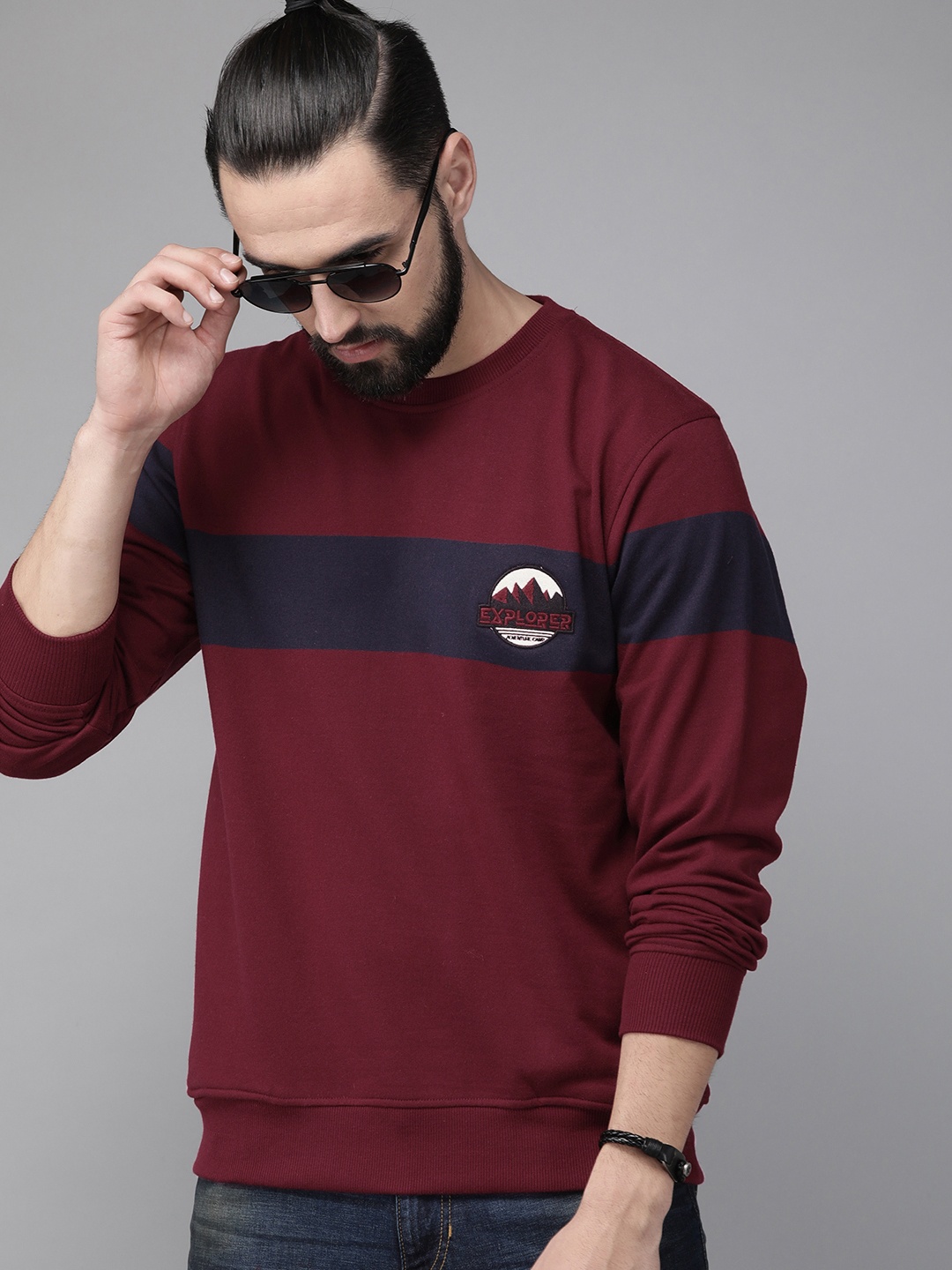 

The Roadster Lifestyle Co Men Maroon & Navy Blue Colourblocked Applique Detail Sweatshirt