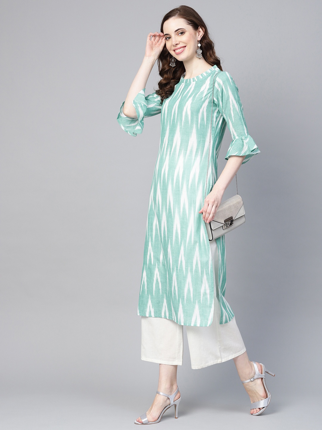 

Yufta Women Turquoise Blue & White Ikat Pattern Straight Kurta