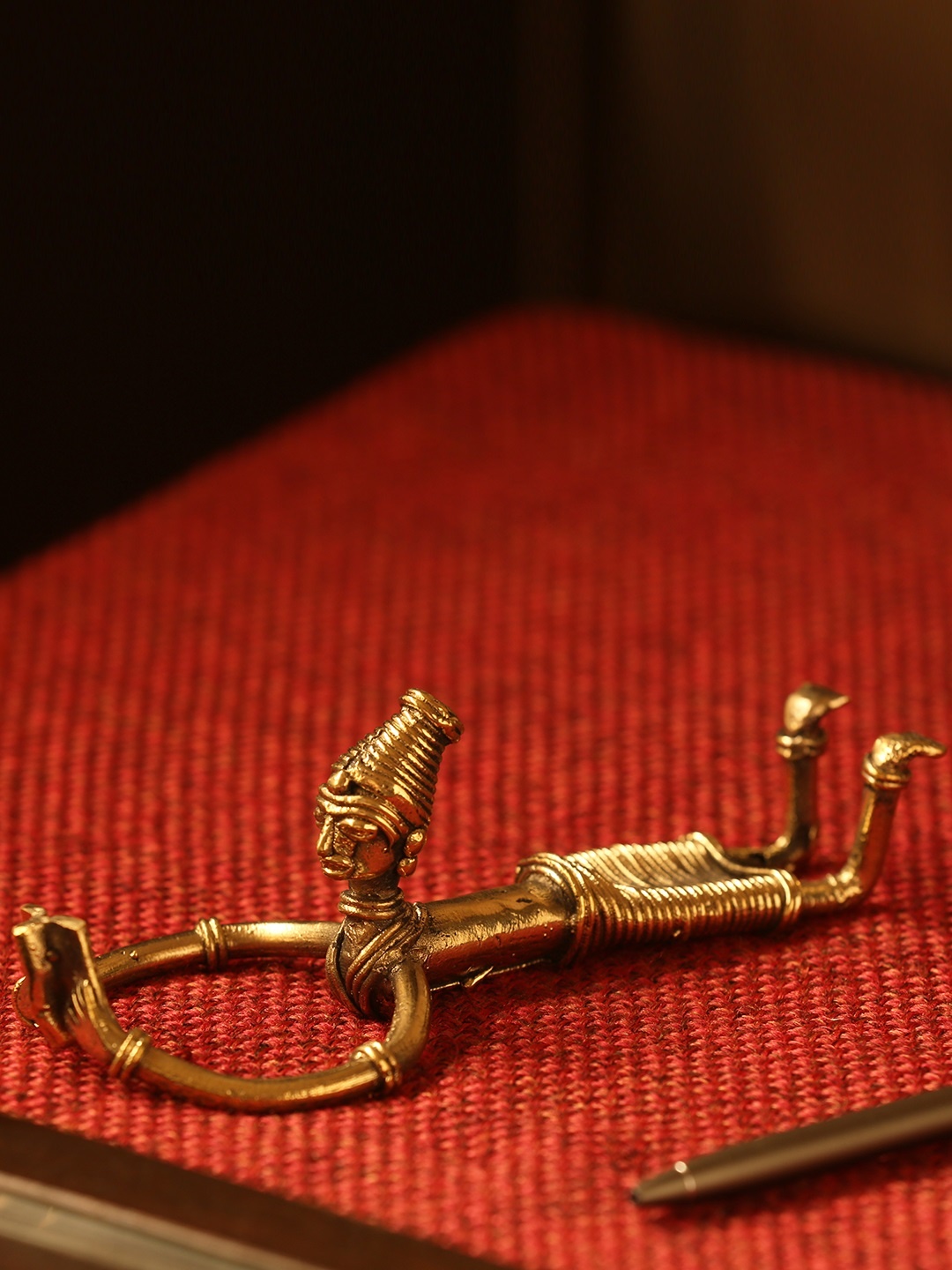 

ExclusiveLane Gold-Toned Reading Man Handcrafted Dhokra Art Showpiece