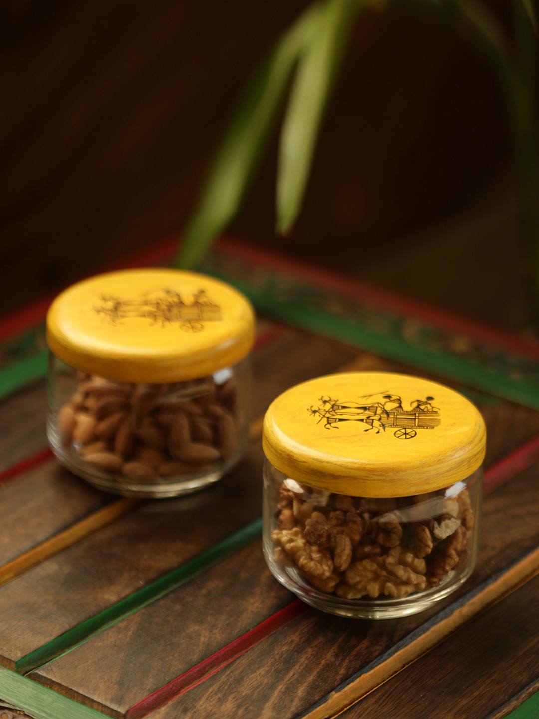 

ExclusiveLane Beaming Warli Hand-Painted Glass & Wood Snacks Jar Set, Transparent
