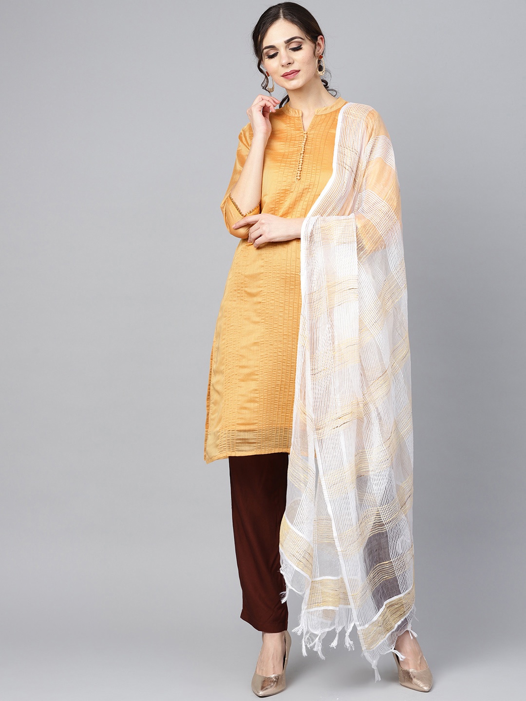 

Nayo Women Mustard Yellow & Coffee Brown Solid Kurta with Trousers & Dupatta