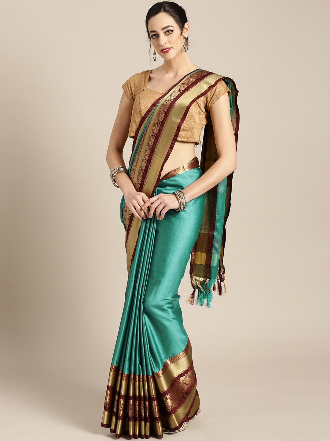 

Rajesh Silk Mills Turquoise Green & Brown Silk Blend Solid Saree