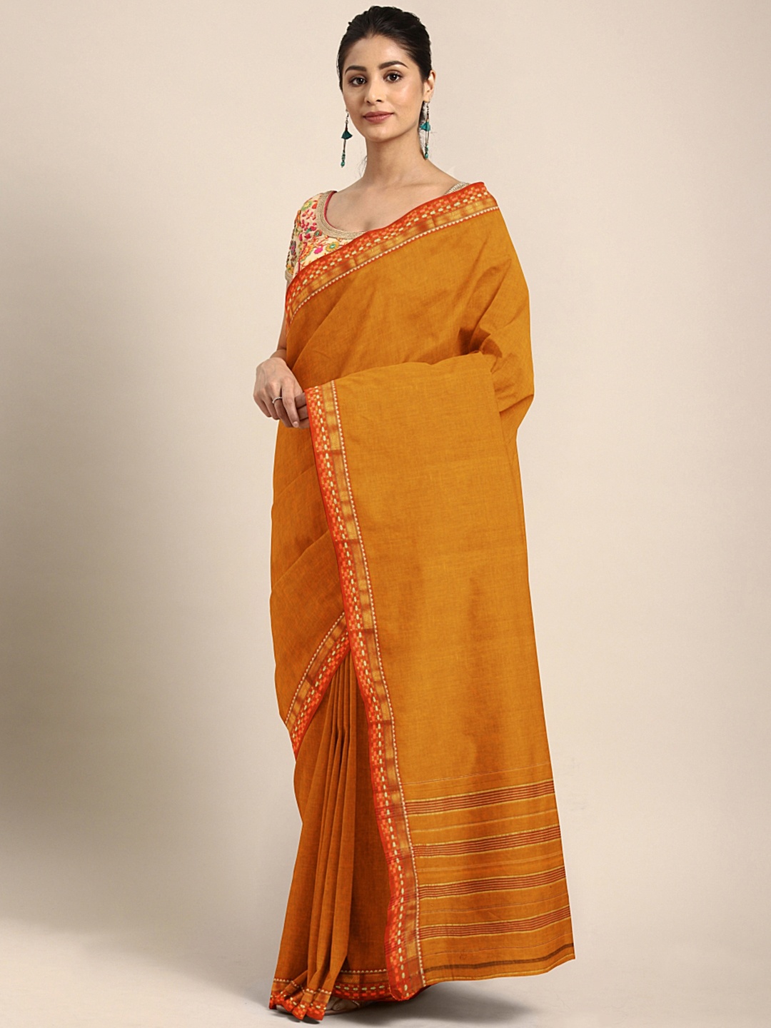 

Pavechas Mustard Orange Pure Cotton Solid Venkatgiri Saree