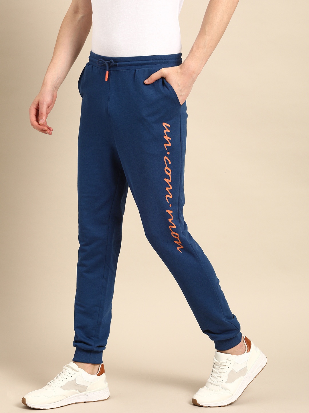 

ether Men Blue Slim Fit Solid Joggers With Printed Detail