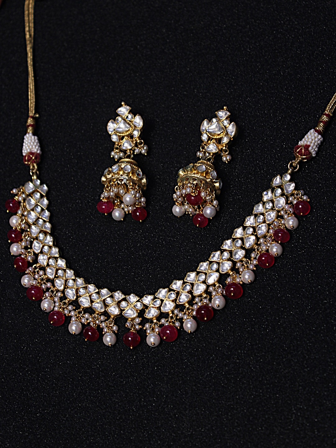 

AccessHer Gold-Plated Kundan and Ruby -Studded Handcrafted Jadua Jewellery Set
